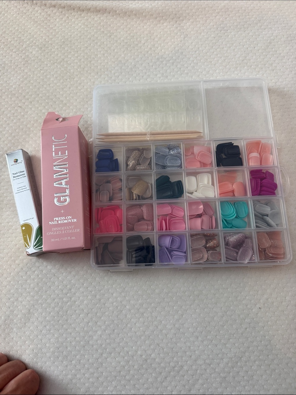 Press on nails, nail glue remover (two different types).
